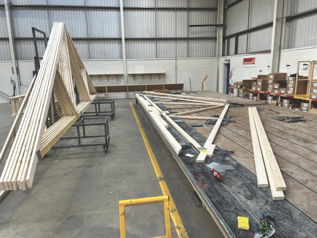 Roof truss being assembled in factory