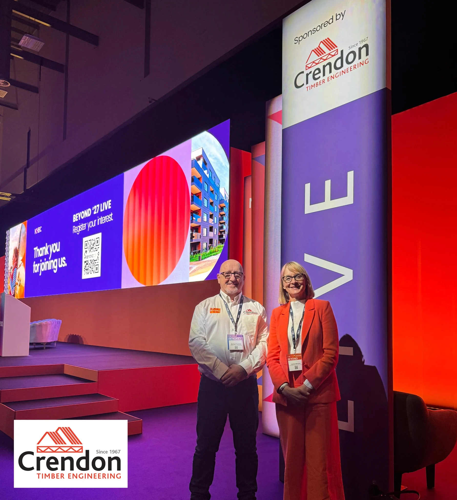 A picture of two people on the side of a stage.